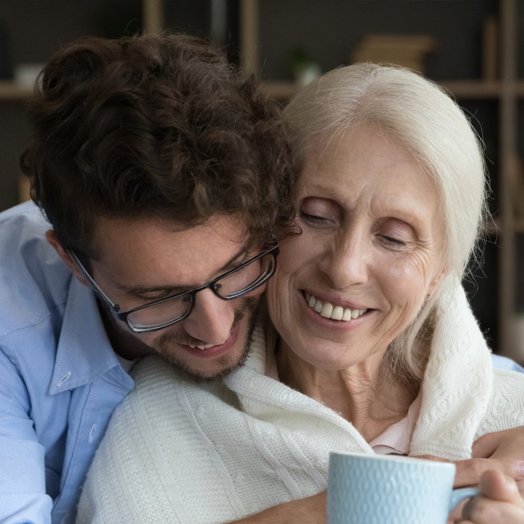 cappella of grand junction adult male child hugging elderly mother