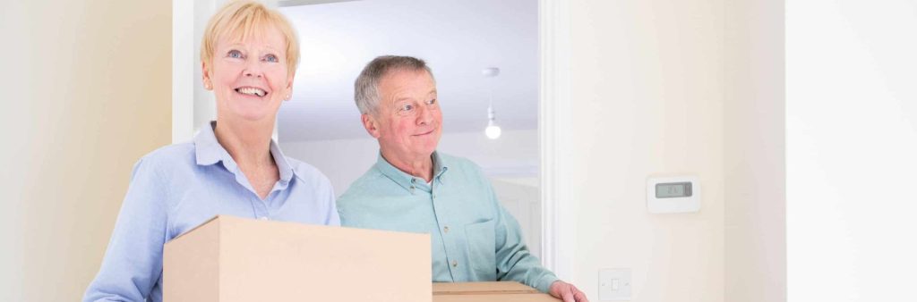 Man and woman move into new home.