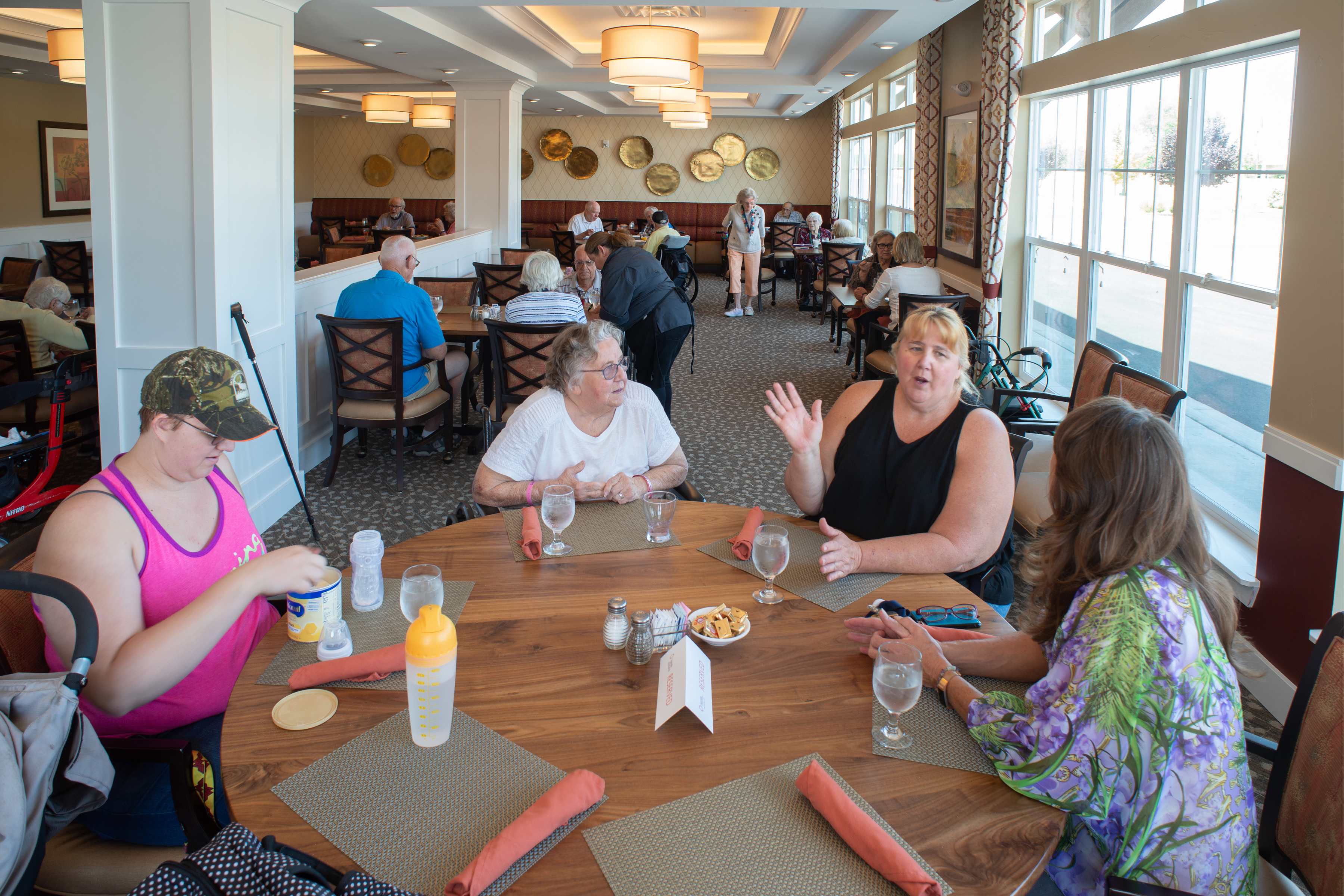 residents chatting in dining table large landscape