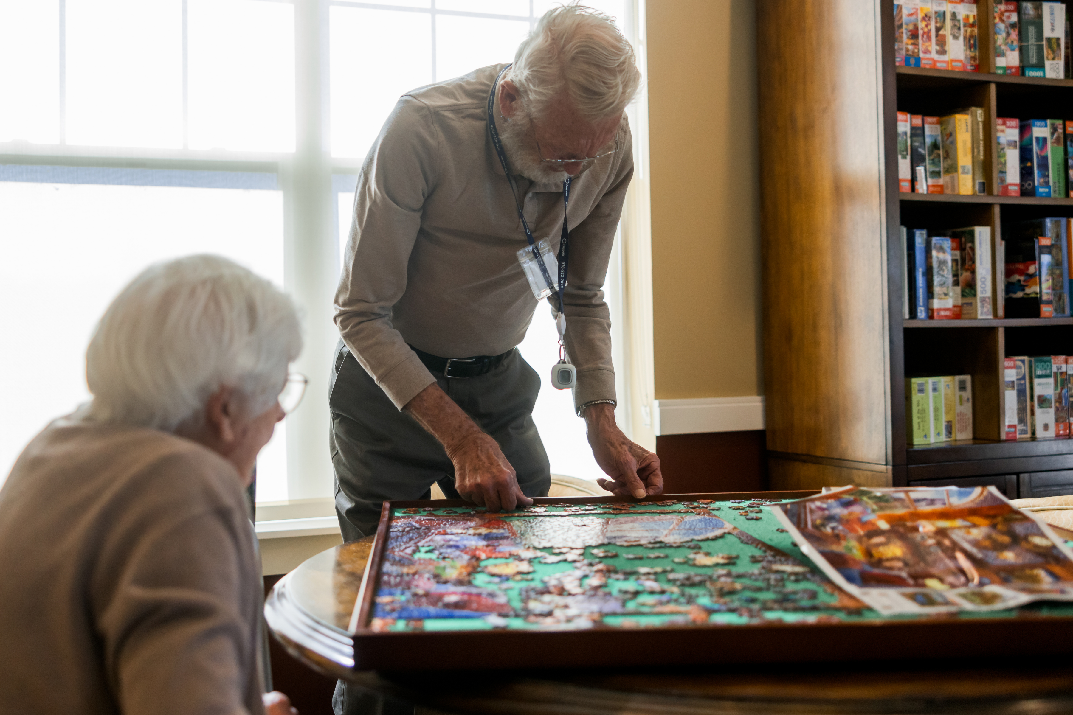 residents working on jigsaw puzzle 2 large landscape