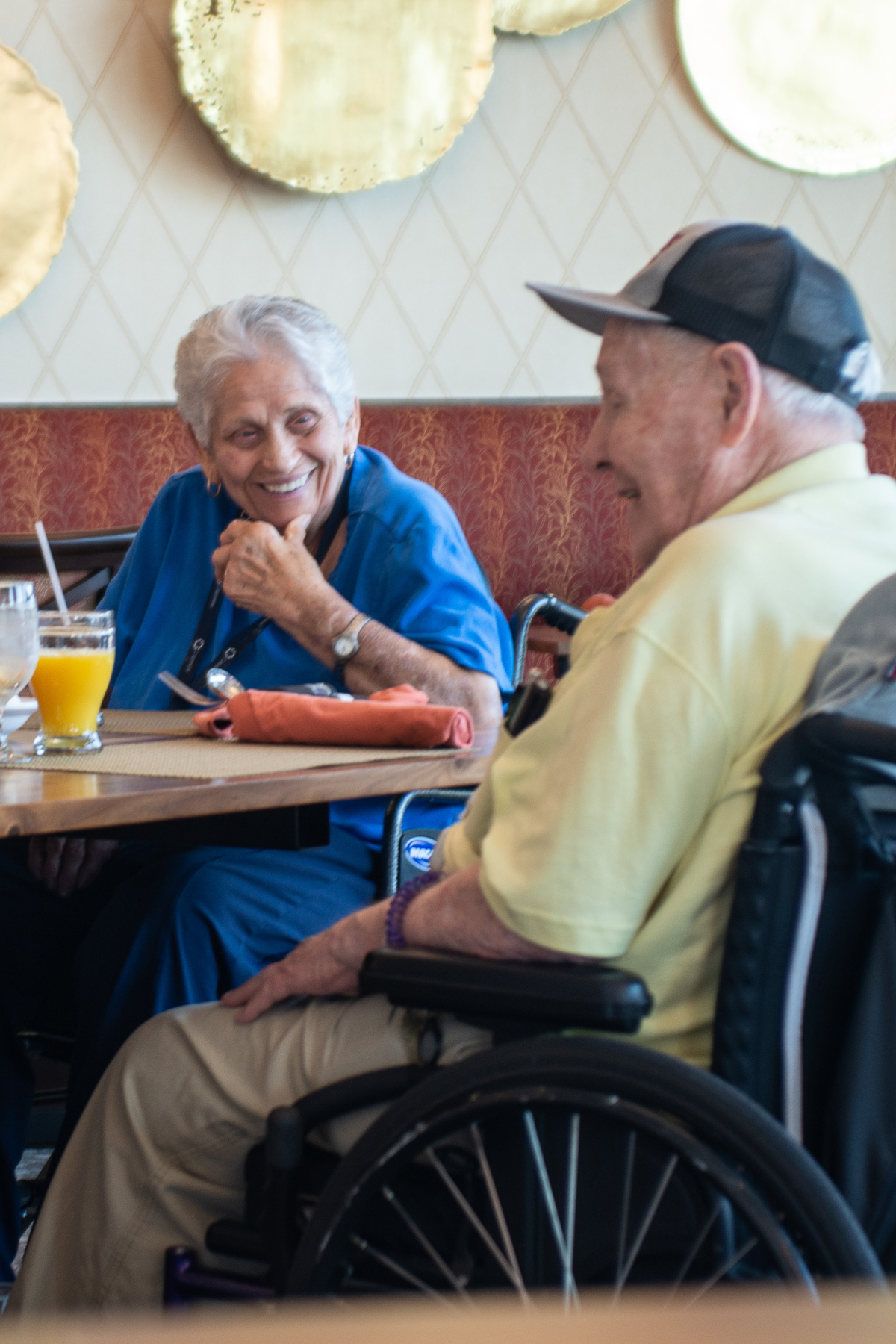 residents chatting at table portrait