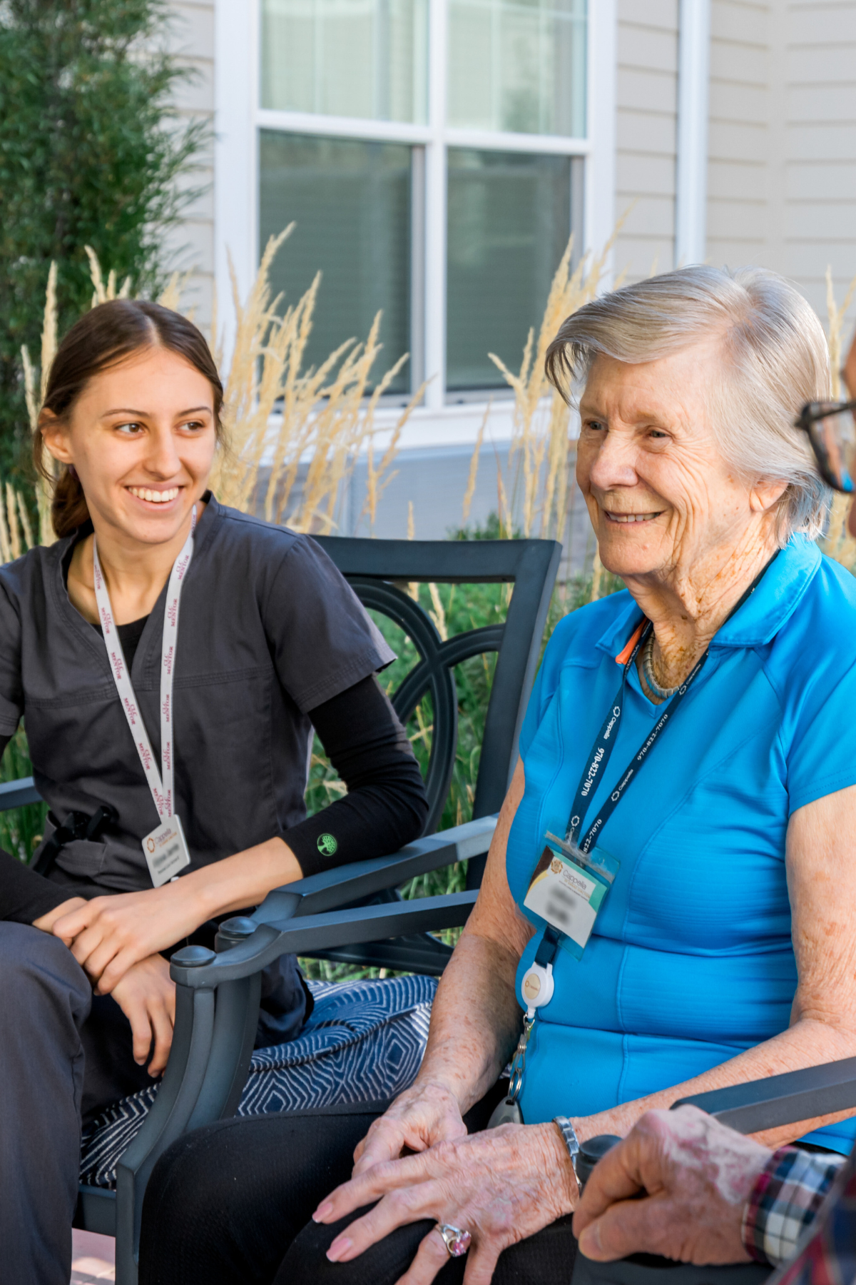 residents and care partner enjoying the fall outside on the pergola 4 portrait