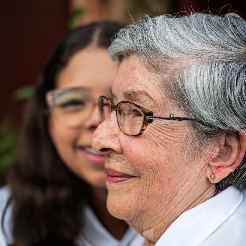 cappella grand junction senior woman profile with granddaughter behind her