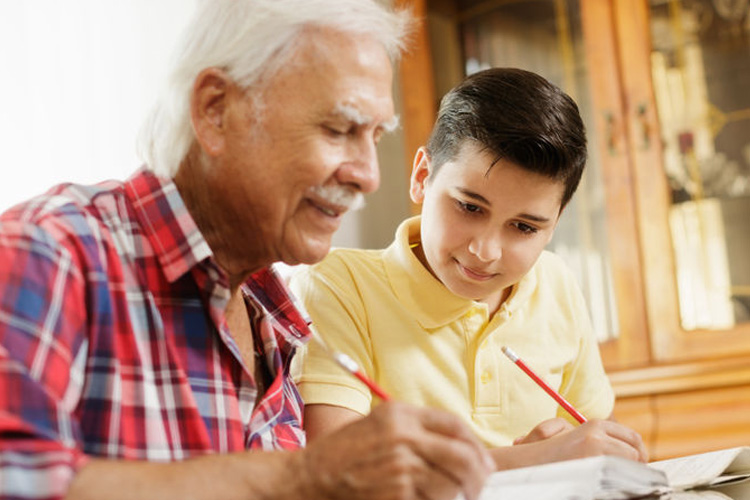 cappella of grand junction senior man helping grandson with homework