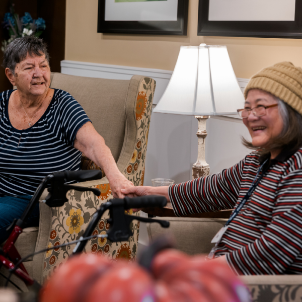 residents sitting in common lounge area square